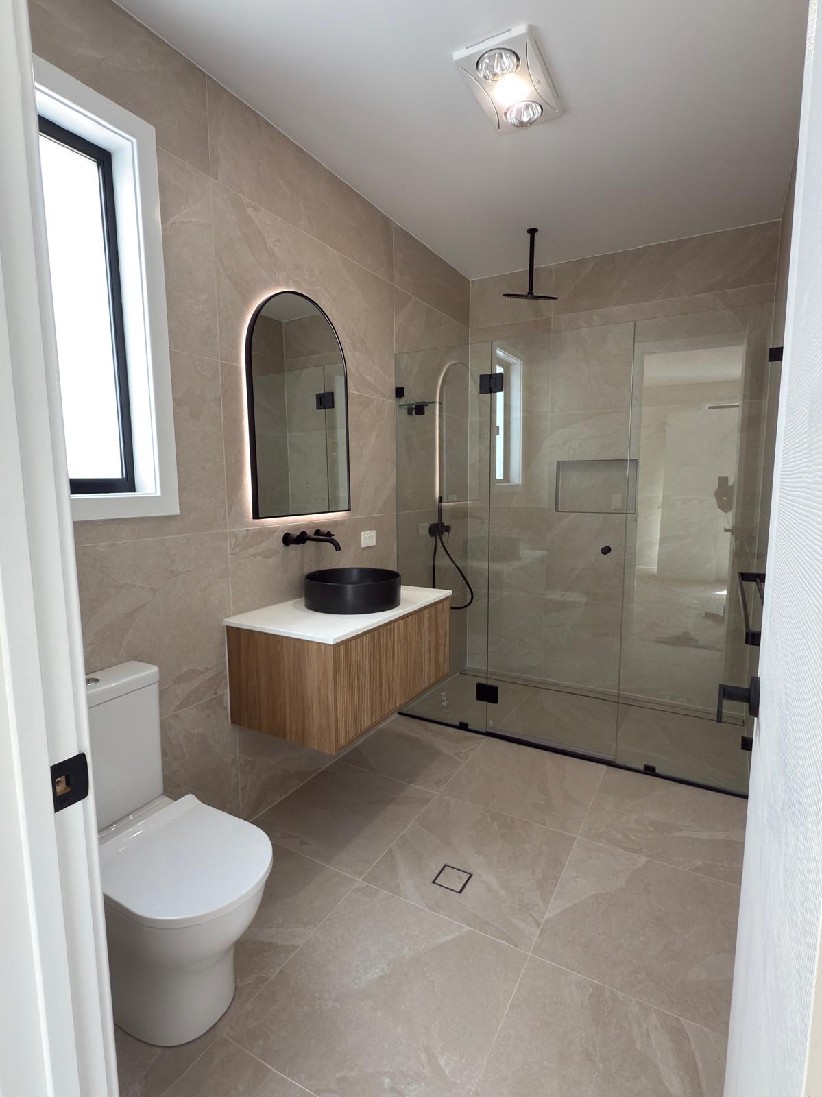 Ensuite — arched mirror & rain shower — Oak Flats | Shellharbour Plumbing