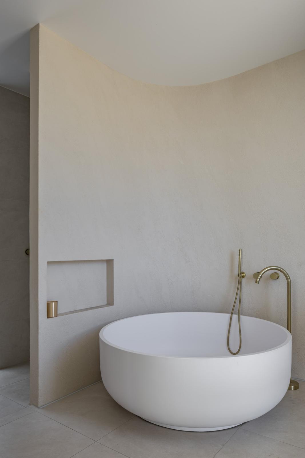 Round freestanding bath & floor mixer — Bathroom Renovations job in Kiama by Shellharbour Plumbing