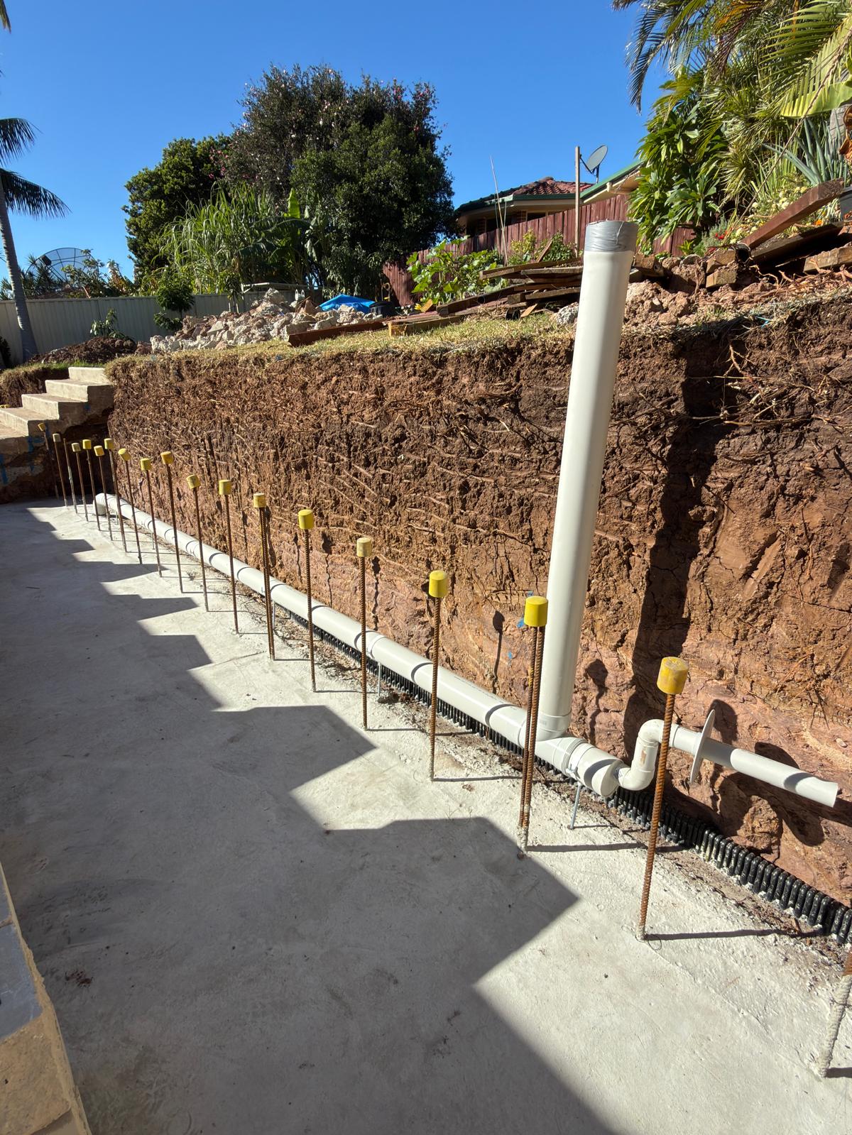 Retaining wall — agg drain & stormwater riser — Warilla | Shellharbour Plumbing