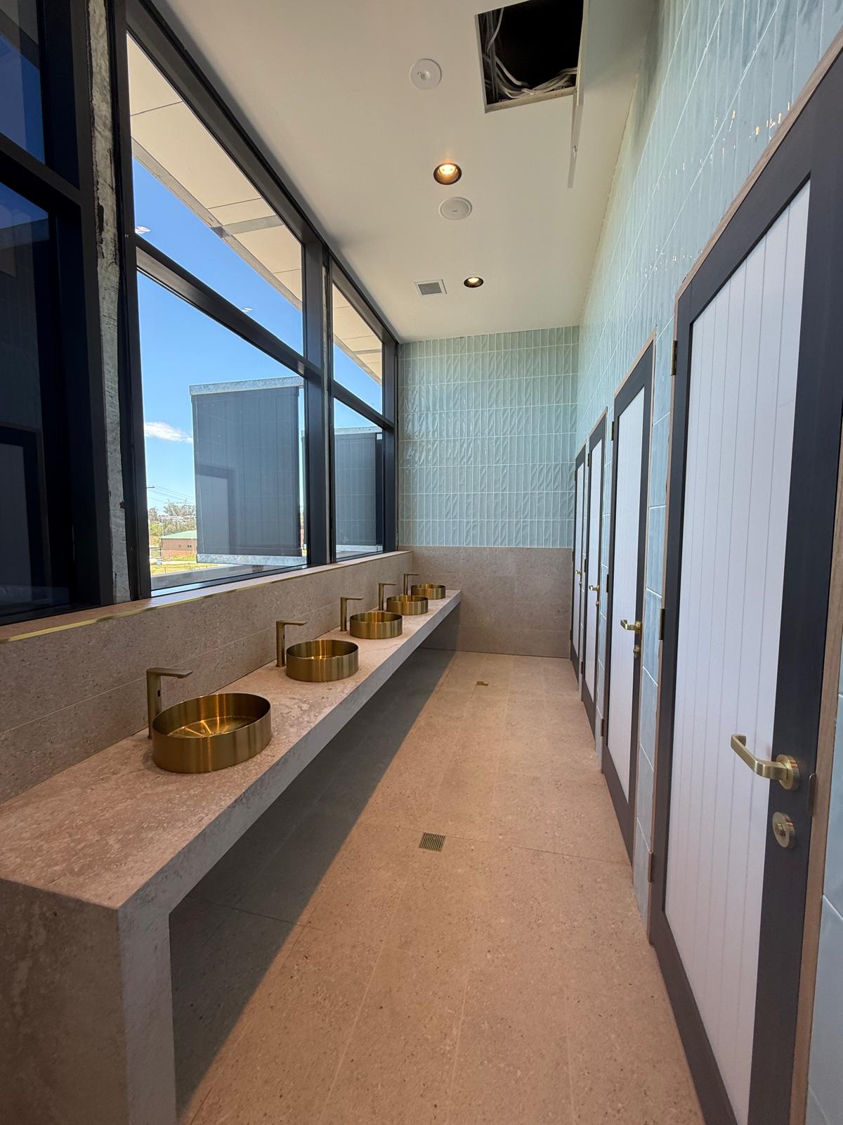 Brushed brass public amenities — Flinders | Shellharbour Plumbing