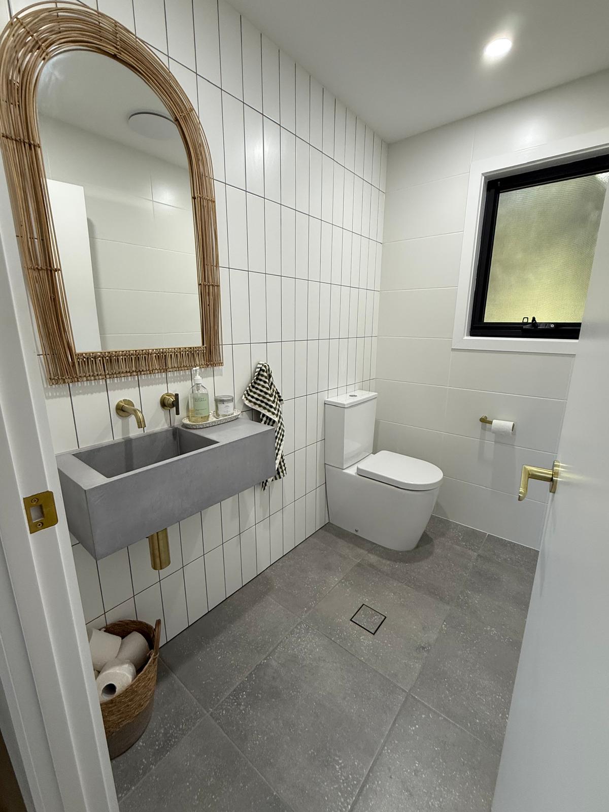 Powder room — concrete basin & brass tapware — Shellharbour | Shellharbour Plumbing