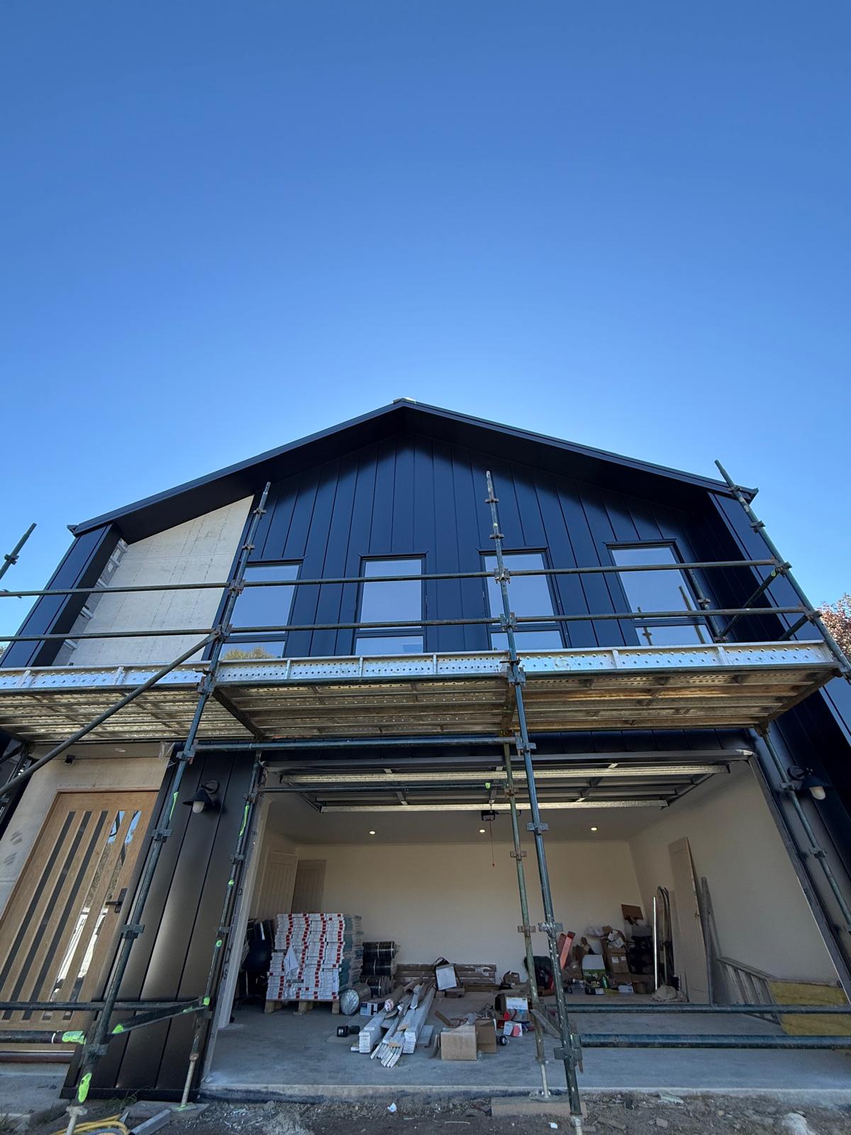 New build — black-clad two-storey — Kiama Downs | Shellharbour Plumbing