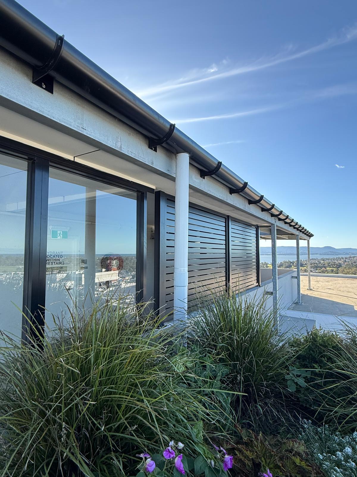 Commercial rooftop — eaves gutter & downpipes — Shellharbour | Shellharbour Plumbing