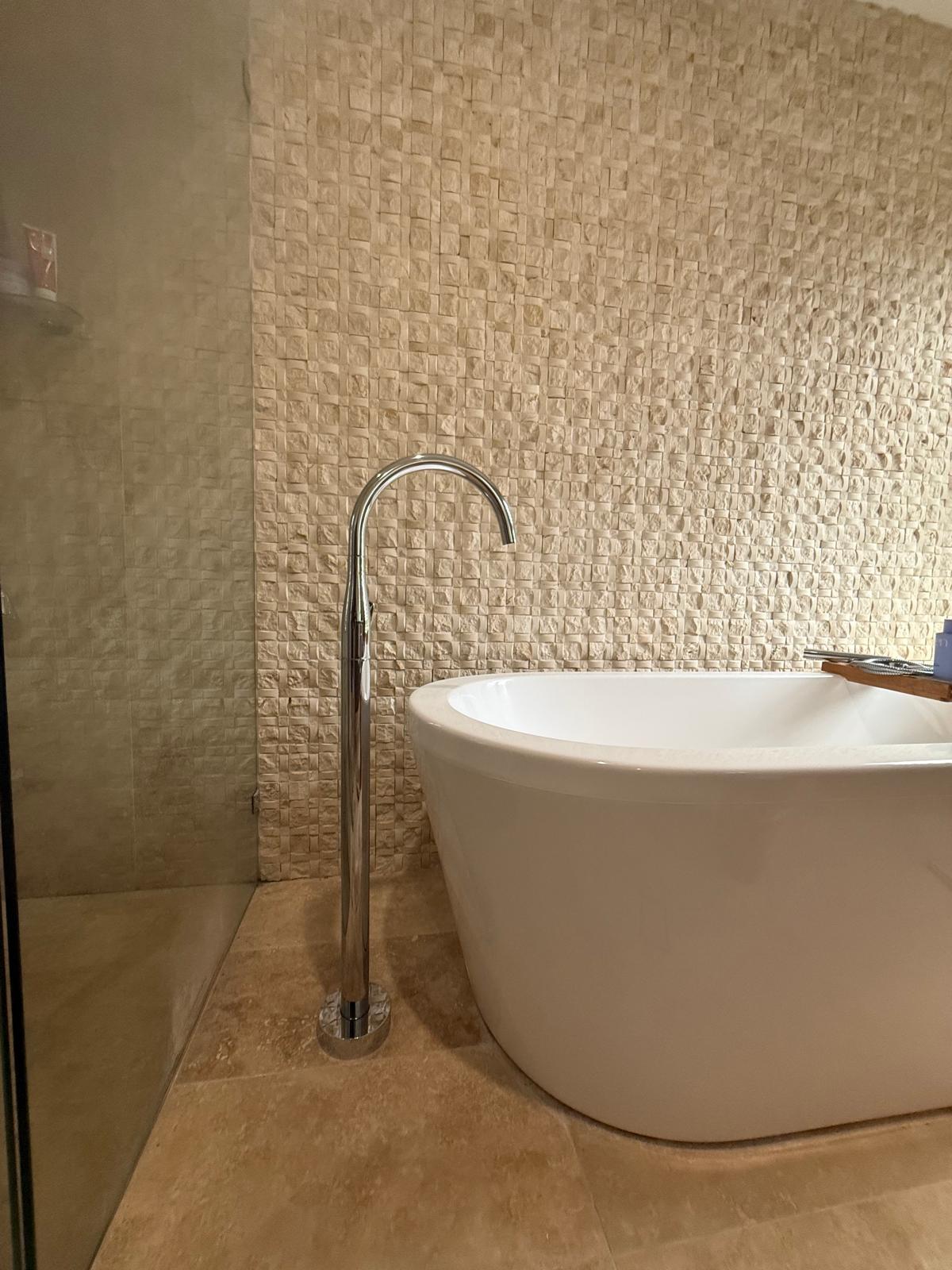 Freestanding bath — stone mosaic feature wall — Gerringong | Shellharbour Plumbing