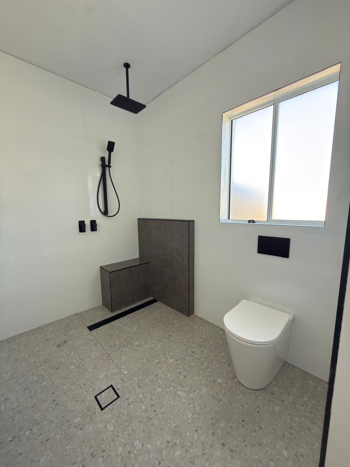 Wet room — terrazzo floor & matte black tapware — Shell Cove | Shellharbour Plumbing
